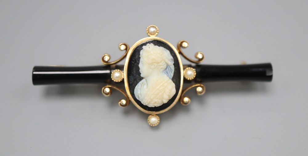 A Victorian gold, enamel and pearl bar brooch, set with a central cameo, 5.5cm